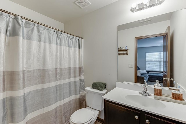 893 Whitfield Oak Rd, Auburn, GA 30011 - bathroom with toilet, vanity, connected bathroom, and a shower with shower curtain