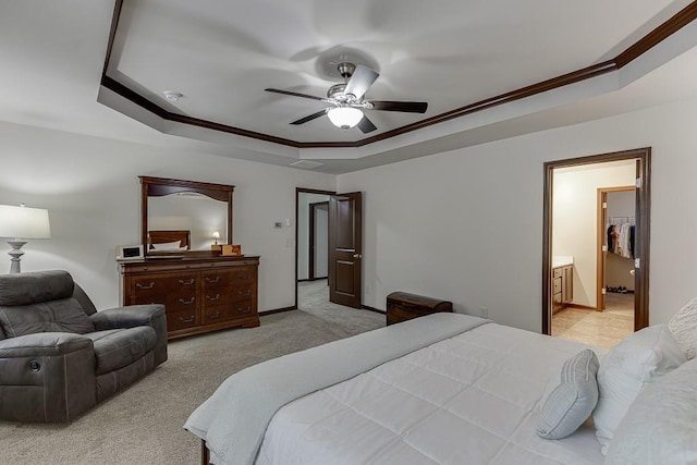 893 Whitfield Oak Rd, Auburn, GA 30011 - bedroom with a tray ceiling, light colored carpet, ornamental molding, a ceiling fan, and baseboards