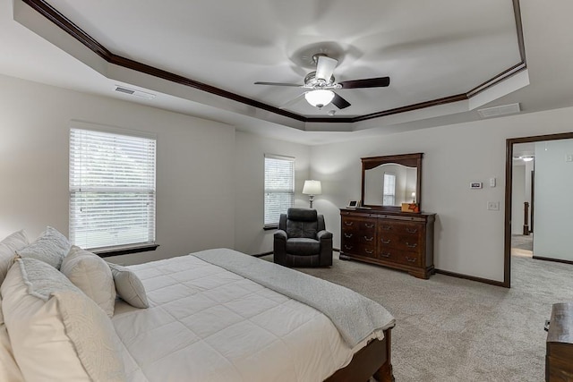 893 Whitfield Oak Rd, Auburn, GA 30011 - carpeted bedroom featuring a raised ceiling, ornamental molding, ceiling fan, and baseboards