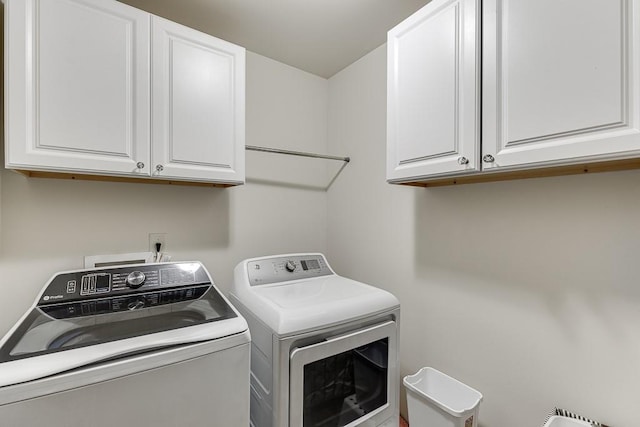 893 Whitfield Oak Rd, Auburn, GA 30011 - laundry room featuring washing machine and clothes dryer and cabinet space
