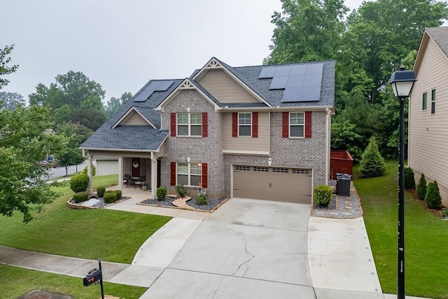 893 Whitfield Oak Rd, Auburn, GA 30011 - craftsman-style home featuring a front yard, brick siding, an attached garage, central AC unit, and concrete driveway