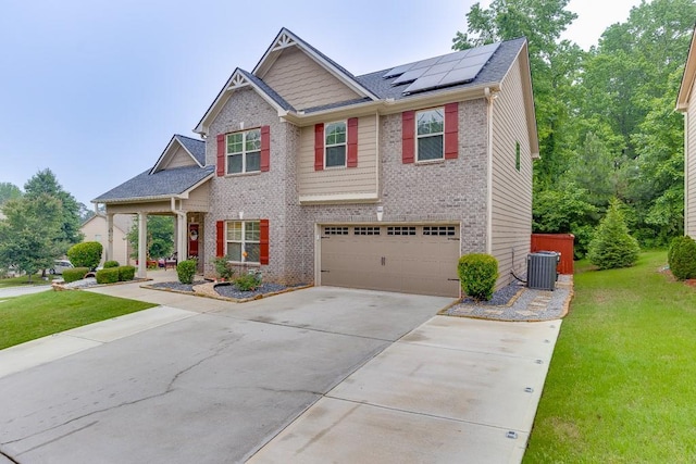 893 Whitfield Oak Rd, Auburn, GA 30011 - craftsman-style home with roof mounted solar panels, driveway, a front yard, and an attached garage