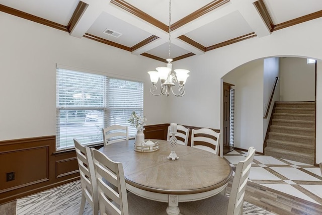 893 Whitfield Oak Rd, Auburn, GA 30011 - dining area with arched walkways, coffered ceiling, plenty of natural light, wainscoting, and beam ceiling