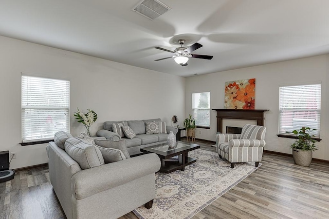 893 Whitfield Oak Rd, Auburn, GA 30011 - living area featuring wood finished floors, a ceiling fan, and baseboards