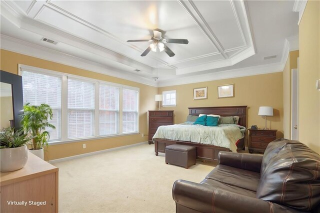 bedroom featuring light carpet, baseboards, visible vents, ornamental molding, and a tray ceiling