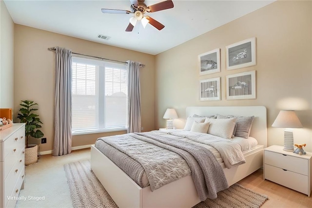 bedroom featuring ceiling fan, baseboards, and visible vents