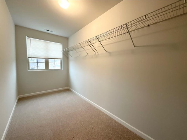 spacious closet with carpet and visible vents