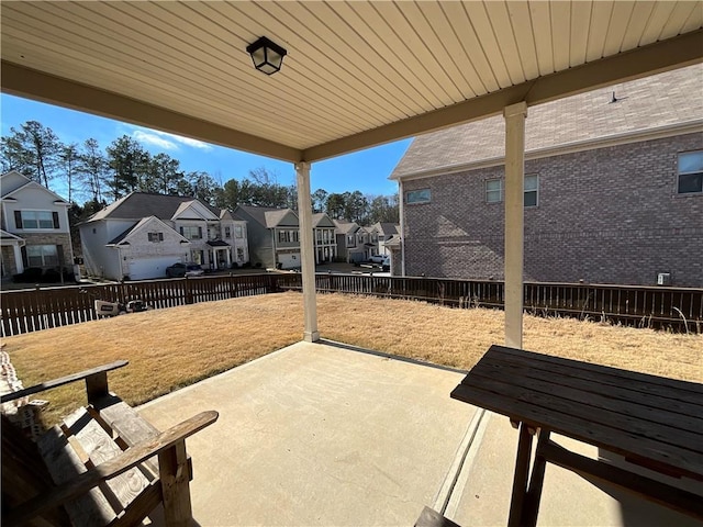 view of patio featuring a residential view and a fenced backyard