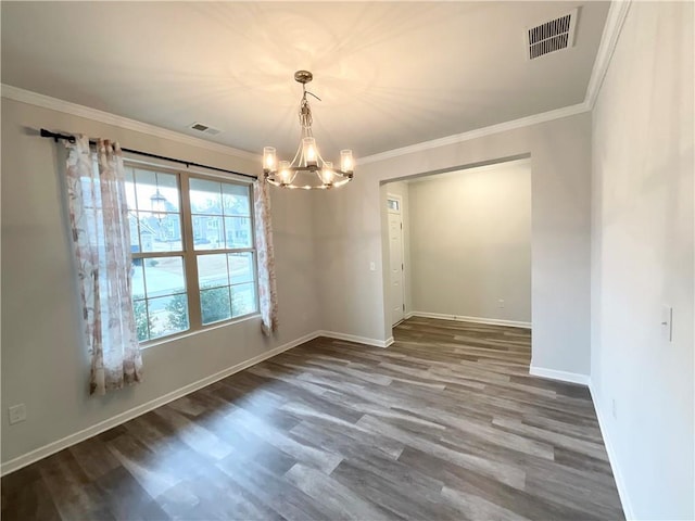 unfurnished room featuring baseboards, visible vents, wood finished floors, and ornamental molding