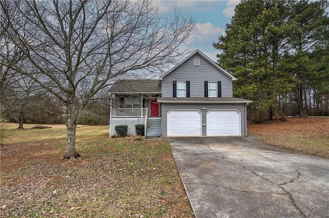 view of front facade with a garage and a porch