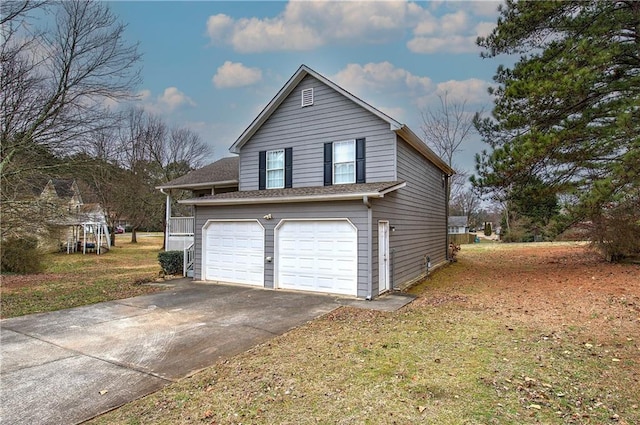 view of property exterior featuring a garage and a lawn