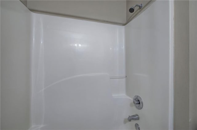 interior details with shower / bathtub combination