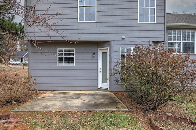 doorway to property with a patio