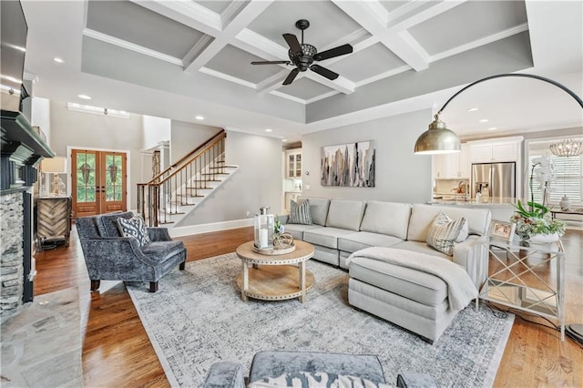 7025 Windsor Hill Psge, Suwanee, GA 30024 - living area featuring healthy amount of natural light, coffered ceiling, recessed lighting, a ceiling fan, and stairway