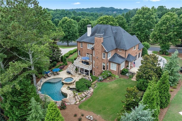 7025 Windsor Hill Psge, Suwanee, GA 30024 - aerial view of property and surrounding area featuring a pool and a heavily wooded area