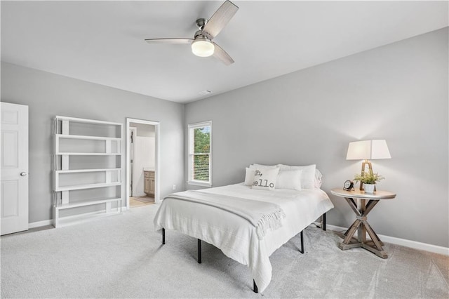 7025 Windsor Hill Psge, Suwanee, GA 30024 - bedroom featuring light colored carpet, ceiling fan, and connected bathroom