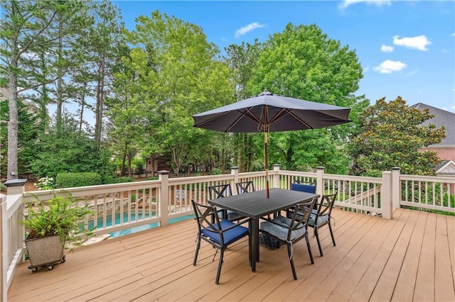 7025 Windsor Hill Psge, Suwanee, GA 30024 - deck with outdoor dining area and view of wooded area