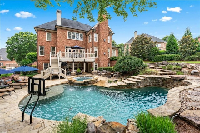 7025 Windsor Hill Psge, Suwanee, GA 30024 - view of swimming pool with stairway, a patio, a deck, and a pool with connected hot tub