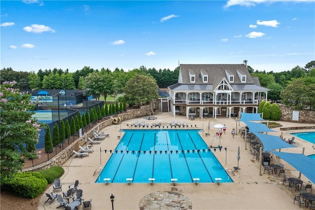 7025 Windsor Hill Psge, Suwanee, GA 30024 - community pool with a diving board, a patio, and view of scattered trees