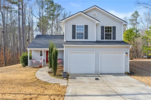 view of front property featuring a garage and covered porch