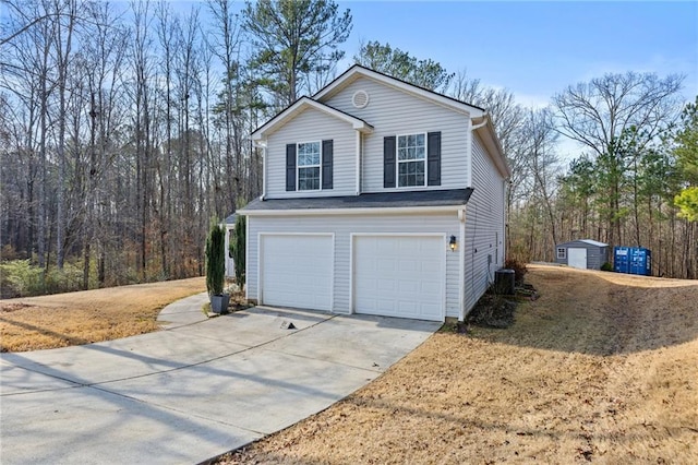 exterior space with a garage and central AC unit