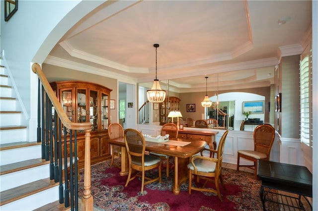 2637 Morningside Trl NW, Kennesaw, GA 30144 - dining area with stairway, a decorative wall, a chandelier, crown molding, and arched walkways