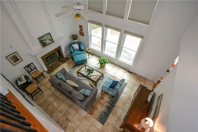 2637 Morningside Trl NW, Kennesaw, GA 30144 - tiled living room featuring a high end fireplace, ceiling fan, and high vaulted ceiling