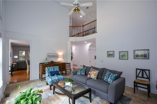 2637 Morningside Trl NW, Kennesaw, GA 30144 - living room featuring a ceiling fan, a towering ceiling, and baseboards