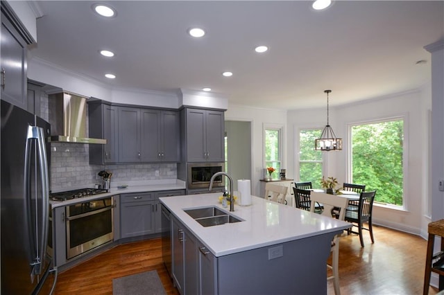 2637 Morningside Trl NW, Kennesaw, GA 30144 - kitchen featuring stainless steel appliances, a sink, wall chimney exhaust hood, ornamental molding, and dark wood finished floors