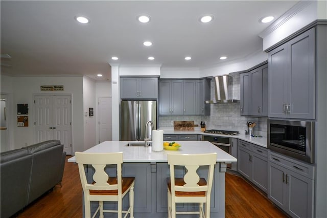 2637 Morningside Trl NW, Kennesaw, GA 30144 - kitchen with gray cabinets, appliances with stainless steel finishes, wall chimney range hood, tasteful backsplash, and crown molding