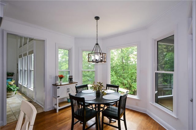 2637 Morningside Trl NW, Kennesaw, GA 30144 - dining room featuring a chandelier, wood finished floors, crown molding, and baseboards