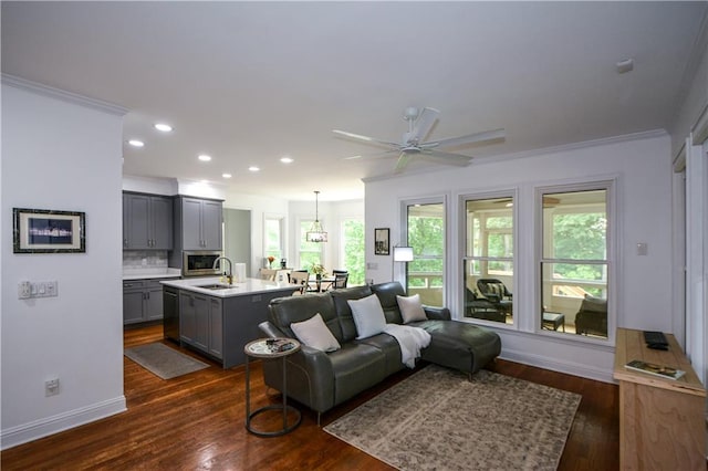 2637 Morningside Trl NW, Kennesaw, GA 30144 - living area featuring ornamental molding, dark wood-type flooring, a ceiling fan, recessed lighting, and baseboards