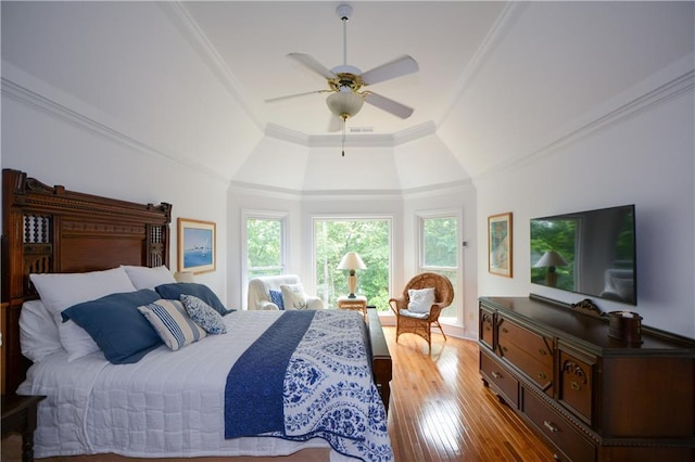 2637 Morningside Trl NW, Kennesaw, GA 30144 - bedroom featuring multiple windows, a tray ceiling, wood-type flooring, ornamental molding, and ceiling fan