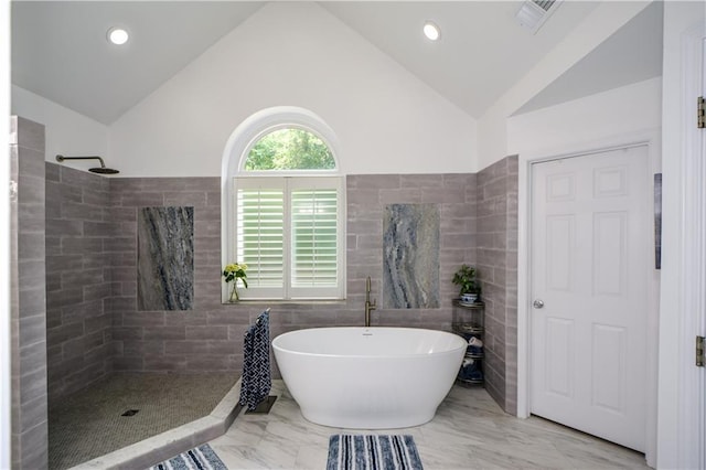 2637 Morningside Trl NW, Kennesaw, GA 30144 - full bath with tile walls, a soaking tub, a tile shower, vaulted ceiling, and recessed lighting