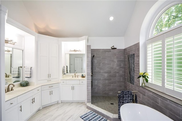 2637 Morningside Trl NW, Kennesaw, GA 30144 - bathroom featuring lofted ceiling, a walk in shower, a freestanding bath, vanity, and marble finish flooring