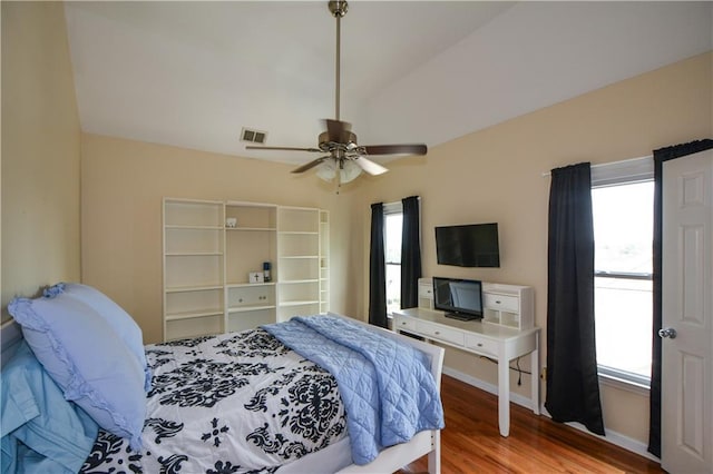 2637 Morningside Trl NW, Kennesaw, GA 30144 - bedroom with multiple windows, wood finished floors, baseboards, vaulted ceiling, and ceiling fan