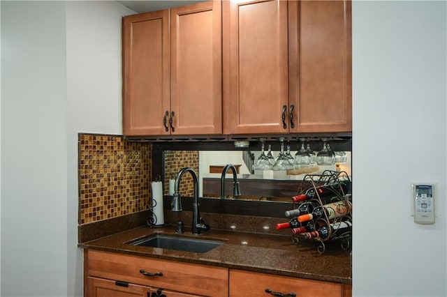 2637 Morningside Trl NW, Kennesaw, GA 30144 - kitchen featuring a sink, dark stone counters, tasteful backsplash, and brown cabinets
