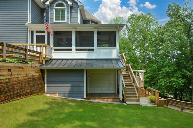 2637 Morningside Trl NW, Kennesaw, GA 30144 - back of property with stairway, a sunroom, a standing seam roof, and an attached garage