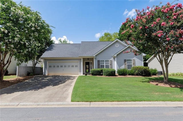 view of front of home featuring a garage and a front yard