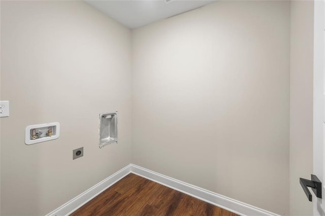 clothes washing area featuring hookup for an electric dryer, washer hookup, and dark hardwood / wood-style flooring