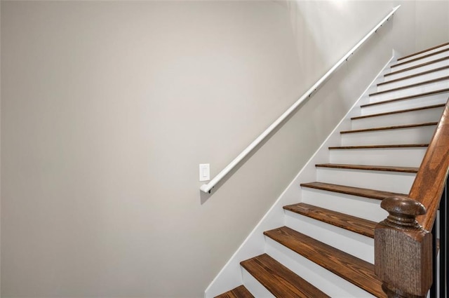 stairway featuring hardwood / wood-style floors