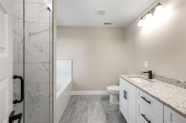 full bathroom featuring toilet, vanity, and independent shower and bath