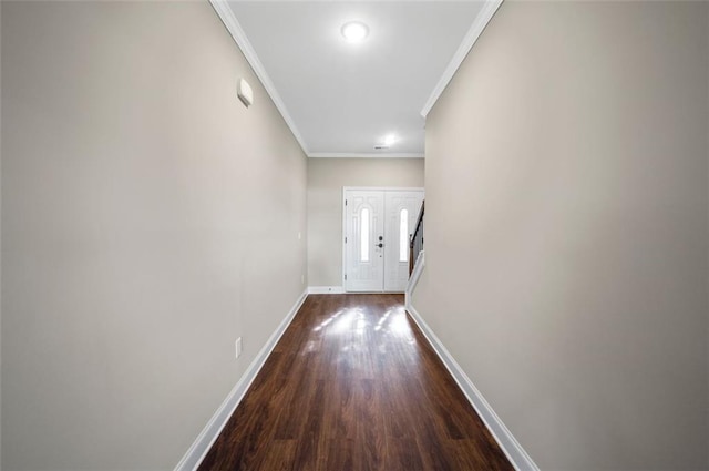 hall with crown molding and dark hardwood / wood-style floors