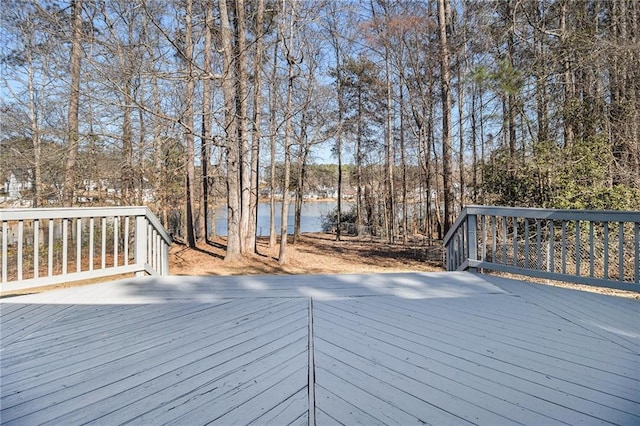 wooden deck with a water view