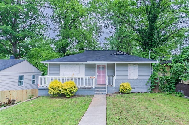 941 Reed Ave, Atlanta, GA 30344 - bungalow-style house featuring a porch, crawl space, and a shingled roof