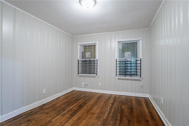 941 Reed Ave, Atlanta, GA 30344 - empty room with dark wood-style flooring, baseboards, and crown molding