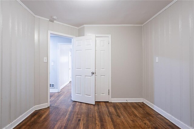 941 Reed Ave, Atlanta, GA 30344 - unfurnished room featuring dark wood-style floors, baseboards, crown molding, and a smoke detector