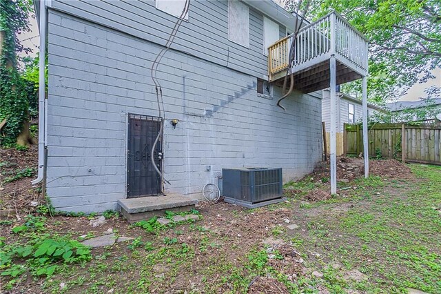 941 Reed Ave, Atlanta, GA 30344 - back of property with fence, central air condition unit, and a wooden deck