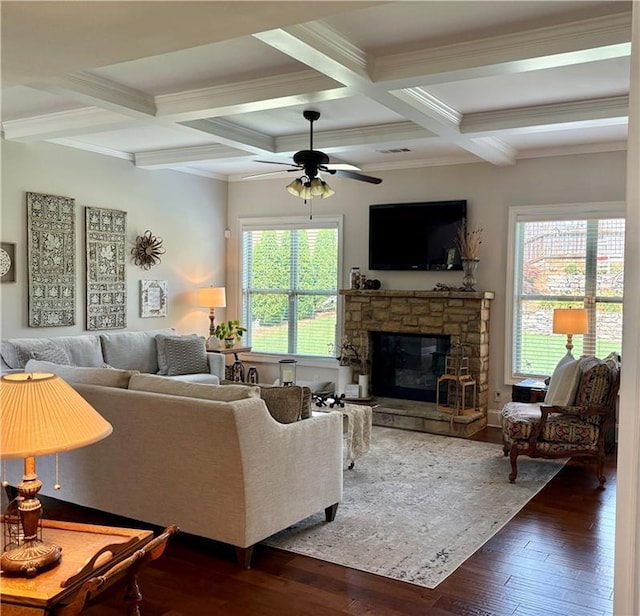 4745 Belcrest Way, Cumming, GA 30040 - living room with ceiling fan, beamed ceiling, ornamental molding, a stone fireplace, and hardwood / wood-style floors