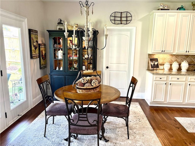 4745 Belcrest Way, Cumming, GA 30040 - dining space with dark wood-style flooring and healthy amount of natural light